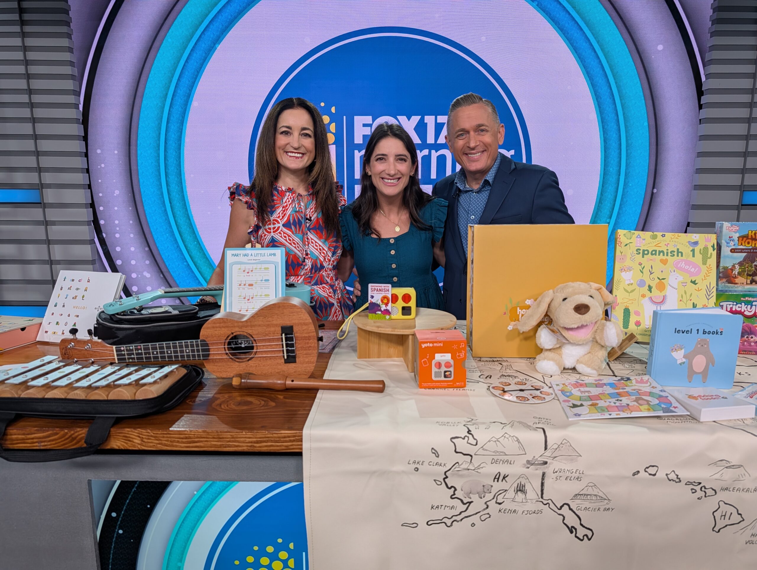 TV hosts on set for FOX 17 with products on the table for back to school